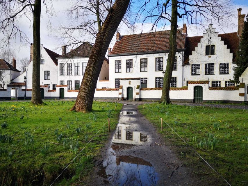 From Brussels: Bruges Day Trip with Boat Tour Option (ENG) - Begijnhof, daffodils, and the quieter Bruges